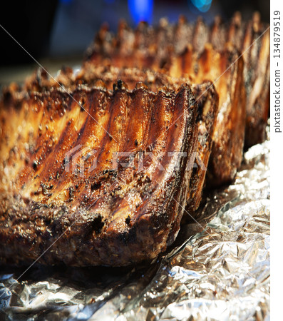 Fried ribs lie on foil Fried ribs lie on foil 134879519