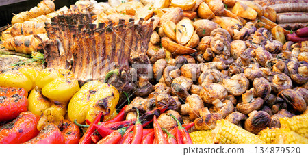 Grilled ribs, meat, potatoes, pepper, mushrooms Grilled ribs, meat, potatoes, pepper, mushrooms 134879520