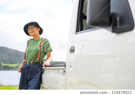 A light truck and an elderly woman [Photography cooperation: Oki Seaside Resort Miyabi] 134879921