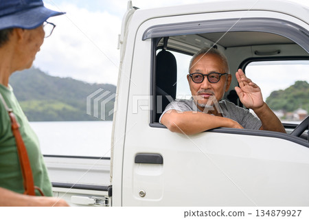 A man in a light truck waves. (Photography provided by Oki Seaside Resort Miyabi) A man in a light truck waves. (Photography provided by Oki Seaside Resort Miyabi) 134879927