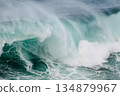 Majestic turquoise wave crashing over reef, powerful ocean surge, dramatic seascape 134879967