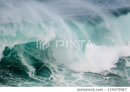 Majestic turquoise wave crashing over reef, powerful ocean surge, dramatic seascape 134879967