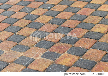 A close-up view of a patterned walkway, background photo 134880008