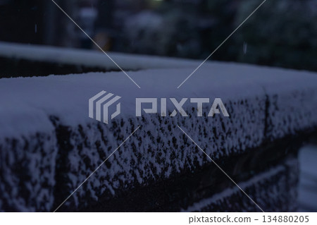 A stone wall with snow 134880205