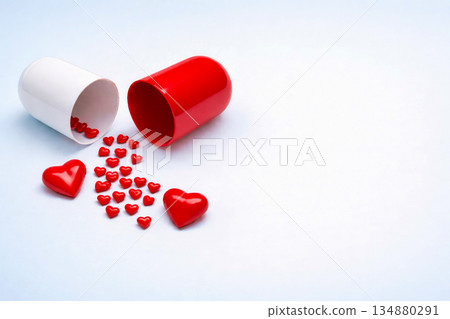 Red and white capsules spilling heart shapes symbol of love care healing and Valentine concept on clean white background Red and white capsules spilling heart shapes symbol of love care healing and Valentine concept on clean white background 134880291