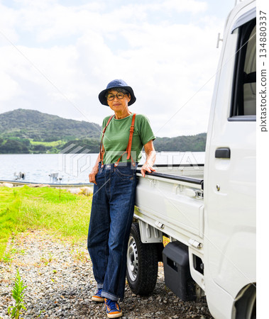 An elderly woman and a light truck (Photo courtesy of Oki Seaside Resort Miyabi) An elderly woman and a light truck (Photo courtesy of Oki Seaside Resort Miyabi) 134880337