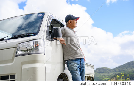 A man taking a break in a light truck (Photo courtesy of Oki Seaside Resort Miyabi) 134880348