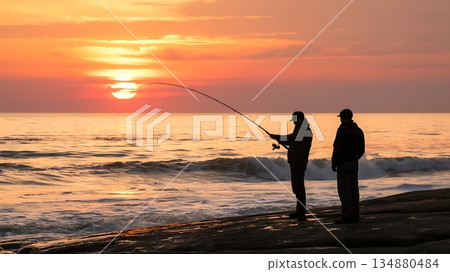 Sunset silhouette of men casting fishing line near ocean 134880484