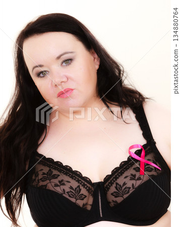 Big woman in bra with pink cancer ribbon Big woman in bra with pink cancer ribbon 134880764