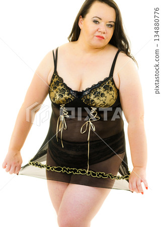 Plus size woman in lingerie tunic Plus size woman in lingerie tunic 134880776