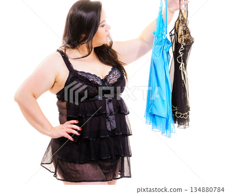 Plus size woman fitting satin nightwear 134880784