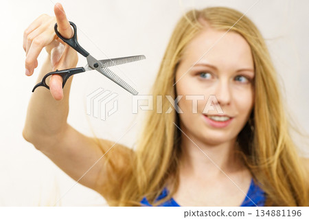 Girl with scissors thinning shears Girl with scissors thinning shears 134881196