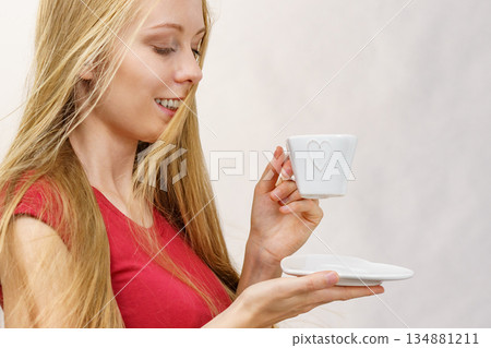 Blonde girl with coffee cup Blonde girl with coffee cup 134881211