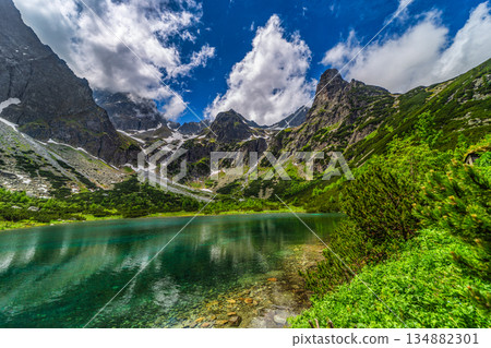 Majestic peaks reflected in Green Lake in High Tatras Majestic peaks reflected in Green Lake in High Tatras 134882301
