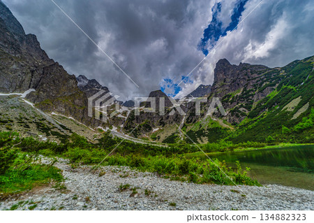 Dark storm clouds over alpine lake Zelene pleso in High Tatras 134882323