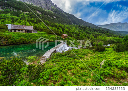 Stone dam and waterfall at Green Lake in High Tatras 134882333