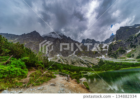Dark storm clouds over alpine lake Zelene pleso in High Tatras 134882334