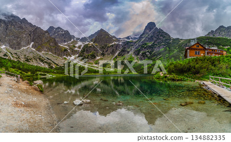 Dark storm clouds over alpine lake Zelene pleso in High Tatras 134882335