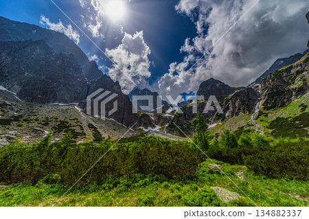 Sun shining over massive granite peaks in High Tatras Sun shining over massive granite peaks in High Tatras 134882337