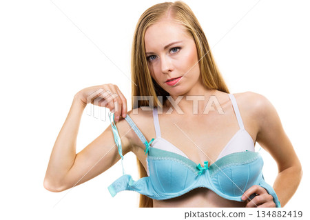 Woman choosing underwired bra Woman choosing underwired bra 134882419