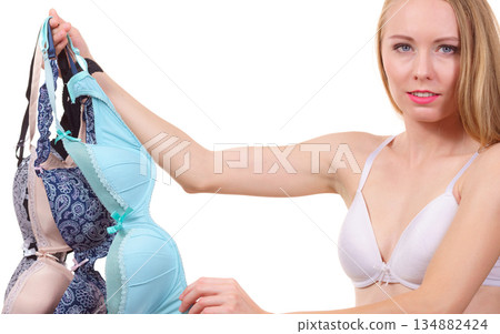 Female holds bras. Bra fitting Female holds bras. Bra fitting 134882424
