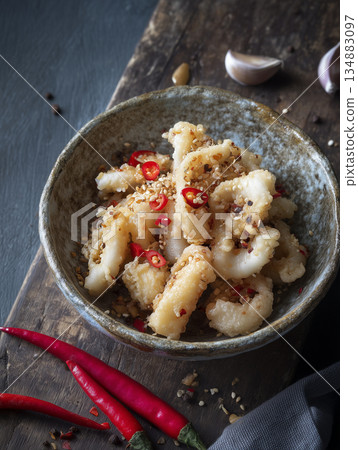 Gourmet Salt and Pepper Squid with Crispy Garlic and Chili Garnish 134883097