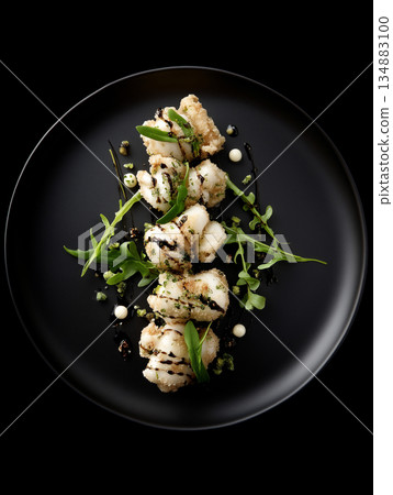 Gourmet Salt and Pepper Squid with Crispy Garlic Aromatic Herbs and Lemon 134883100