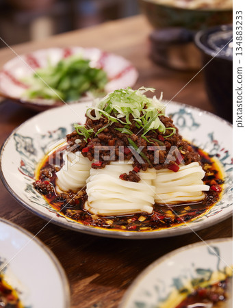 Gourmet plated Zhajiangmian with noodle nests and spicy soybean sauce. Gourmet plated Zhajiangmian with noodle nests and spicy soybean sauce. 134883233
