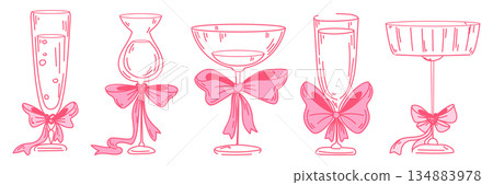 Cocktail glasses with pink bows and ribbons 134883978