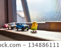 Image of a cute miniature toy placed by the window 134886111