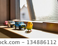 Image of a cute miniature toy placed by the window 134886112