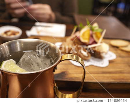 Copper mug cocktail and smoked plate 134886454