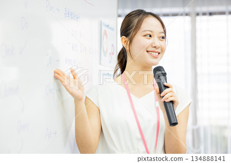 business woman giving a presentation 134888141