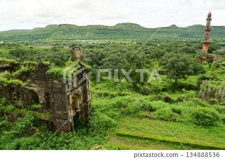 Top view of Daulatabad fort and Chand Minar (Tower of the Moon) , Built with massive stone walls showcasing medieval military architecture and cultural heritageIt. Top view of Daulatabad fort and Chand Minar (Tower of the Moon) , Built with massive stone walls showcasing medieval military architecture and cultural heritageIt. 134888536