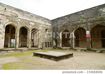 Classic arched entrance at Daulatabad Fort is an ancient fort located in Maharashtra, India. Originally named Deogiri, it is a fort built from natural rocks and is very strong. Classic arched entrance at Daulatabad Fort is an ancient fort located in Maharashtra, India. Originally named Deogiri, it is a fort built from natural rocks and is very strong. 134888696