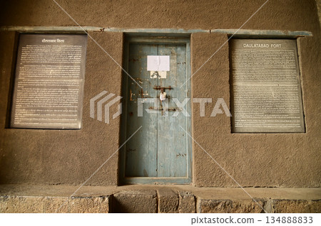 Wooden classic door at Daulatabad Fort is an ancient fort located in Maharashtra, India. Originally named Deogiri, it is a fort built from natural rocks and is very strong. Wooden classic door at Daulatabad Fort is an ancient fort located in Maharashtra, India. Originally named Deogiri, it is a fort built from natural rocks and is very strong. 134888833
