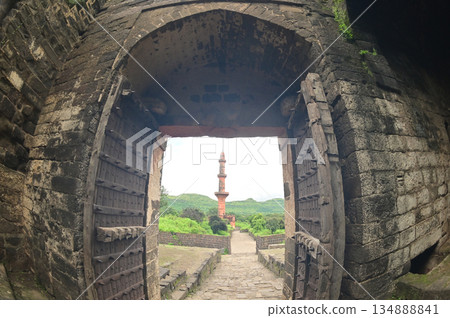Classic arched entrance at Daulatabad Fort see Chand Minar (Tower of the moon ) is an ancient fort. it is a fort built from natural rocks and is very strong. 134888841