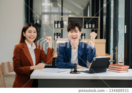 Asian business team and lawyers discussing contract papers sitting at the table. Concepts of law, advice, legal services. at office Asian business team and lawyers discussing contract papers sitting at the table. Concepts of law, advice, legal services. at office 134889531