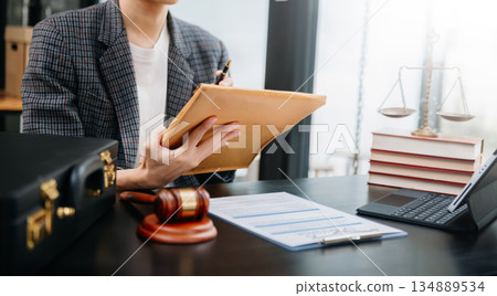 justice advice and law judge legislation concept. tribunal Attorney lawyer working with documents and white gavel on tabel 134889534