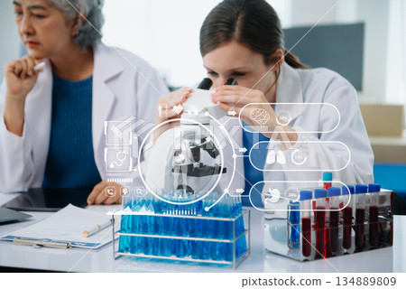 DNA molecule testing concepts. The doctor in a mask examines DNA molecules on the chemical laboratory with virtual icon 134889809