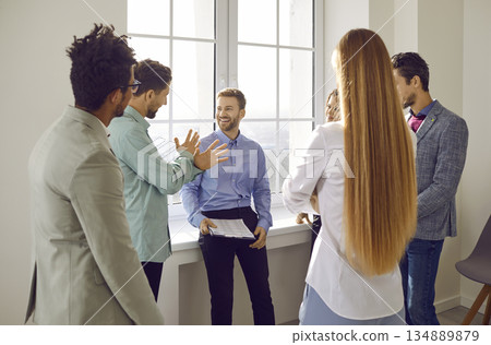 Team of young business people having a discussion during a work meeting in the office 134889879