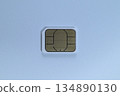Close-up of a nano SIM card placed on a white background 134890130