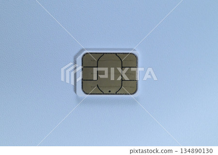 Close-up of a nano SIM card placed on a white background 134890130