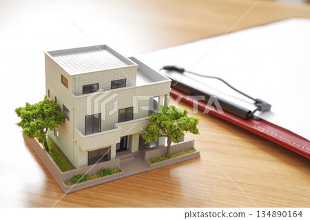 Image of comparing real estate properties and preparing documents Image of comparing real estate properties and preparing documents 134890164