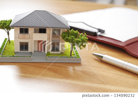 Image of comparing real estate properties and preparing documents 134890232