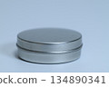 A simple, round silver aluminum can placed on a white background 134890341