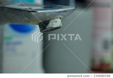 Close-up of Limescale and Calcium Build-up on Faucet. High quality photo 134890346