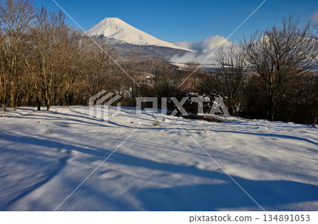 Mount Fuji in the morning as seen from the snow-covered summit of Mount Kurodake in the Ashitaka Mountains Mount Fuji in the morning as seen from the snow-covered summit of Mount Kurodake in the Ashitaka Mountains 134891053