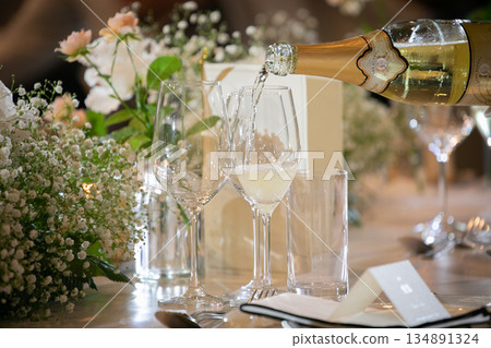 Table scene with champagne glasses 134891324
