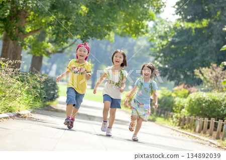 Three children playing in the park 134892039